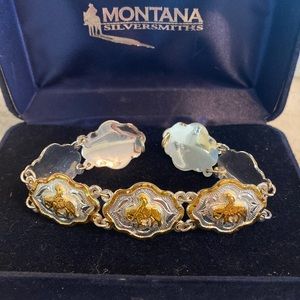 Silver bracelet with trail rider.